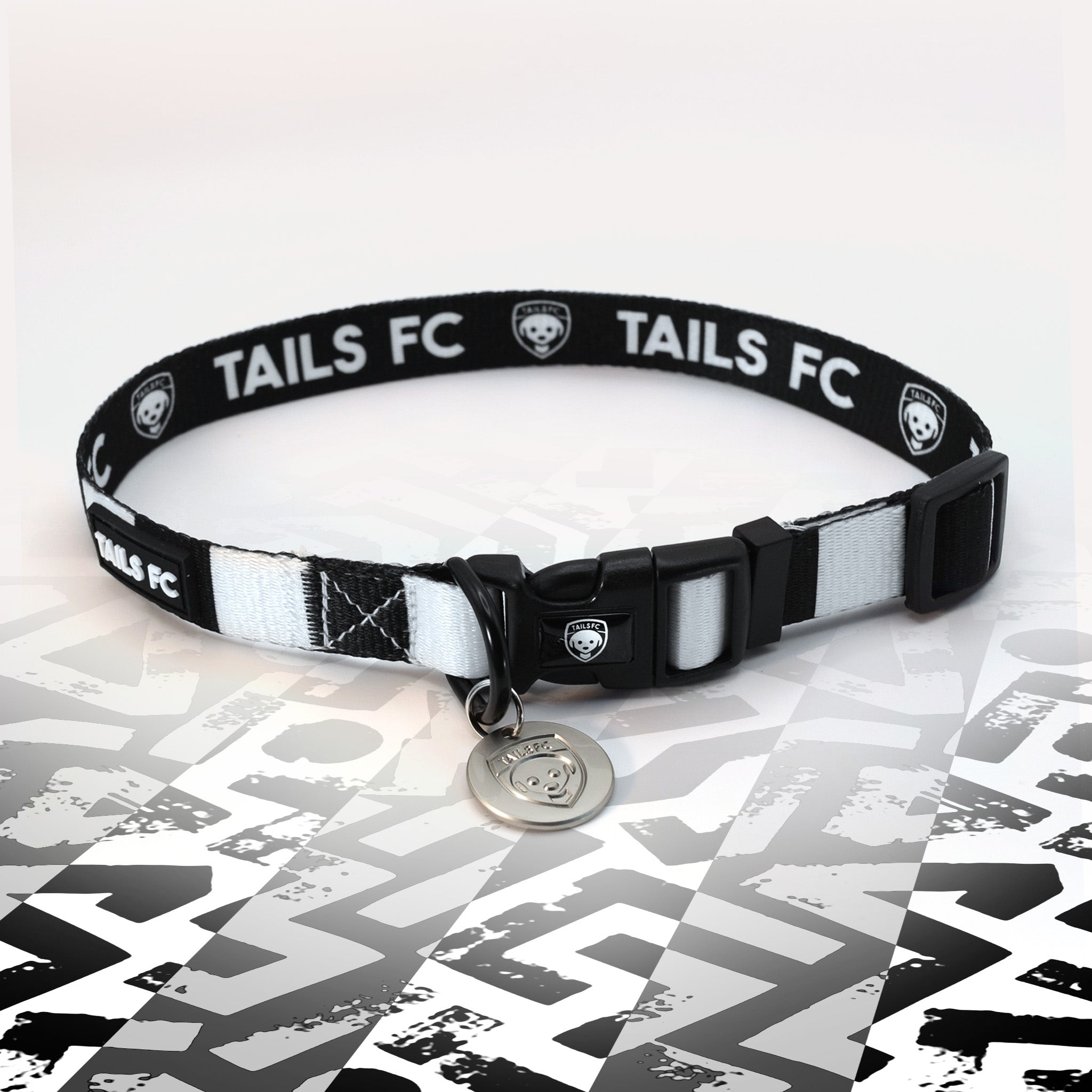 Black and white stripe dog collar with 'TAILS FC' logo