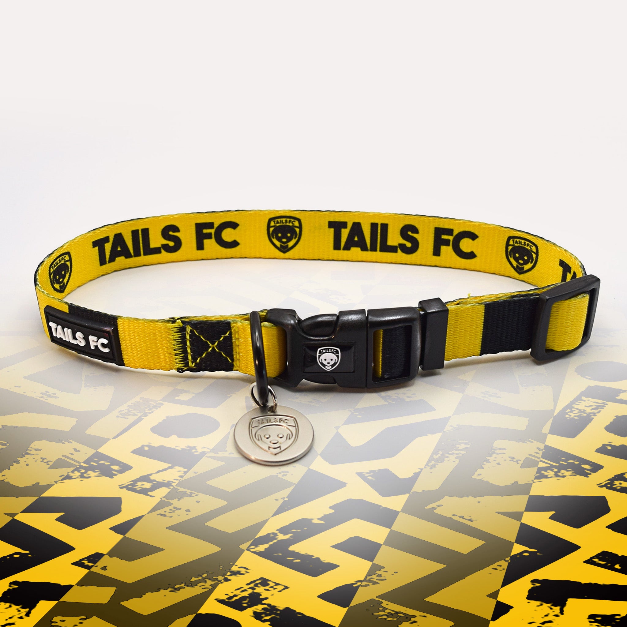 Yellow and black stripe dog collar with 'TAILS FC' logo
