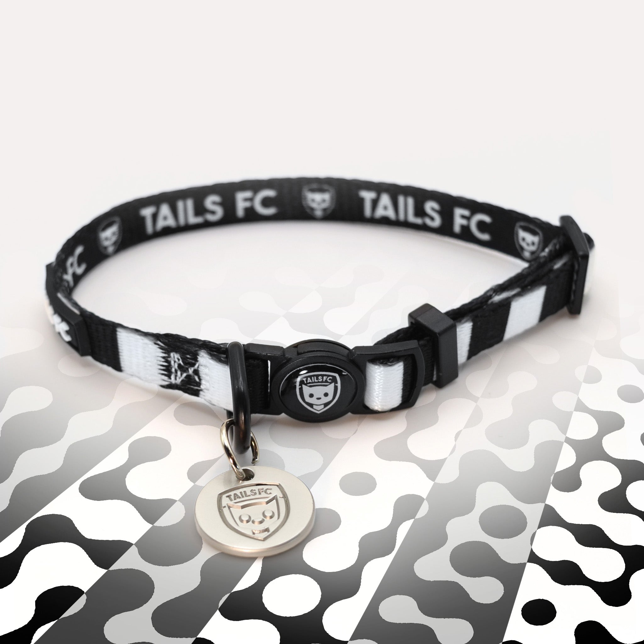 Black and white stripe cat collar with 'TAILS FC' logo
