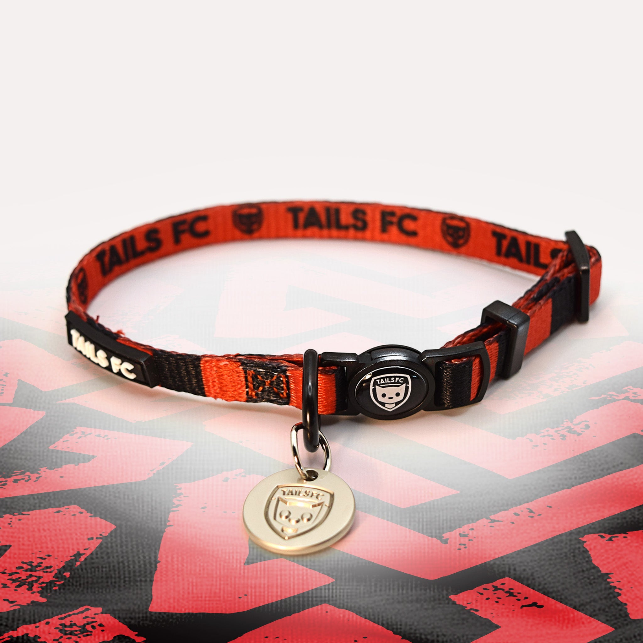 Manchester Utd red and black striped cat collar.
