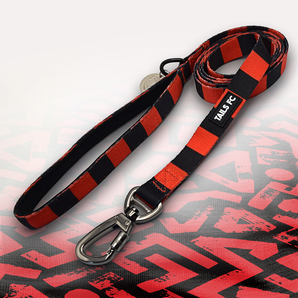 Man Utd red and black striped dog lead.