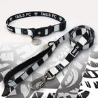 Derby black and white striped pet collar and leash set with 'TAILS FC' branding.