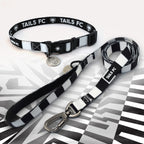 Black and White striped pet collar and leash set with 'TAILS FC' branding.