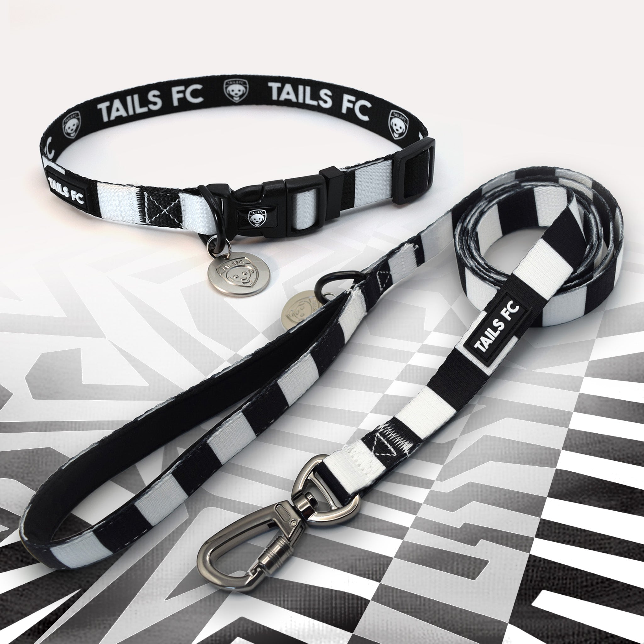 Black and White striped pet collar and leash set with 'TAILS FC' branding.