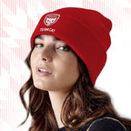 Person wearing a Tails FC red beanie with a logo and text on a white background