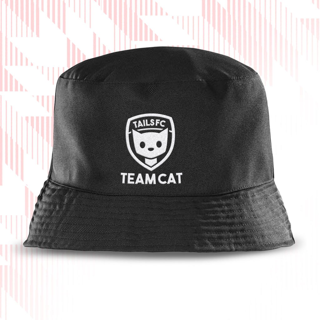 Black bucket hat with 'TAILS FC Team Cat' logo on a light pink background