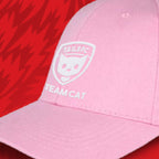 Pink cap with 'TAILS FC TEAM CAT' logo on a red background