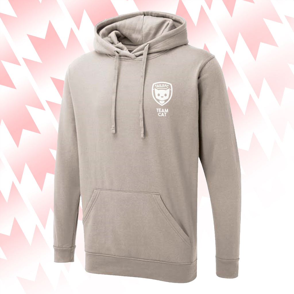 Tails FC Beige hoodie with Team Cat logo on a pink and white abstract background