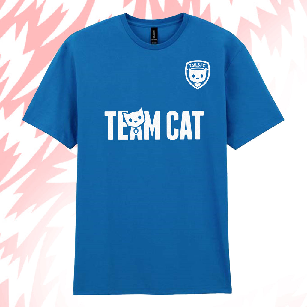 Tails FC Blue t-shirt with 'Team Cat' text and logo on a pink and white abstract background