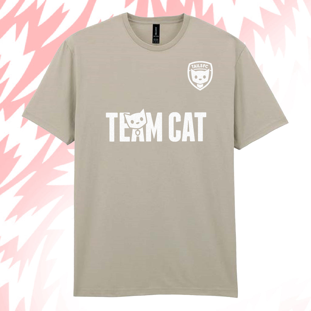 Tails FC Beige t-shirt with 'Team Cat' text and logo on a pink and white abstract background