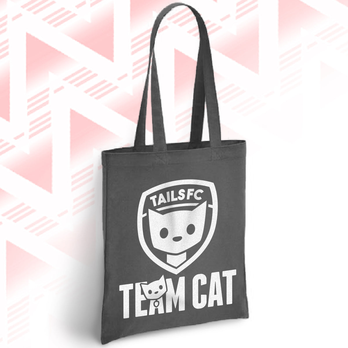Black tote bag with 'TAILSFC Team Cat' logo on a pink geometric patterned background