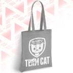 Gray tote bag with 'TAILSFC Team Cat' design on a pink and white geometric patterned background