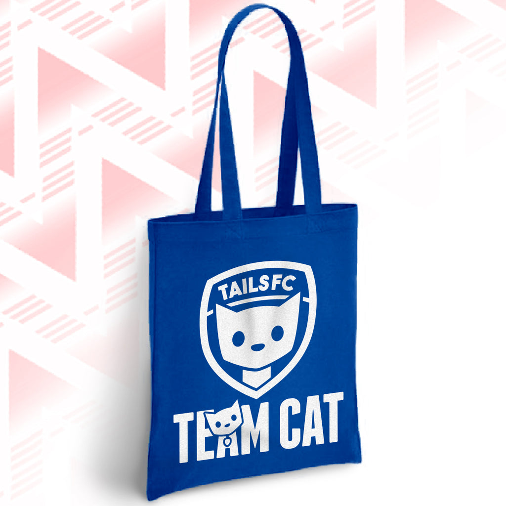 Blue tote bag with 'TAILSFC Team Cat' design on a geometric patterned background