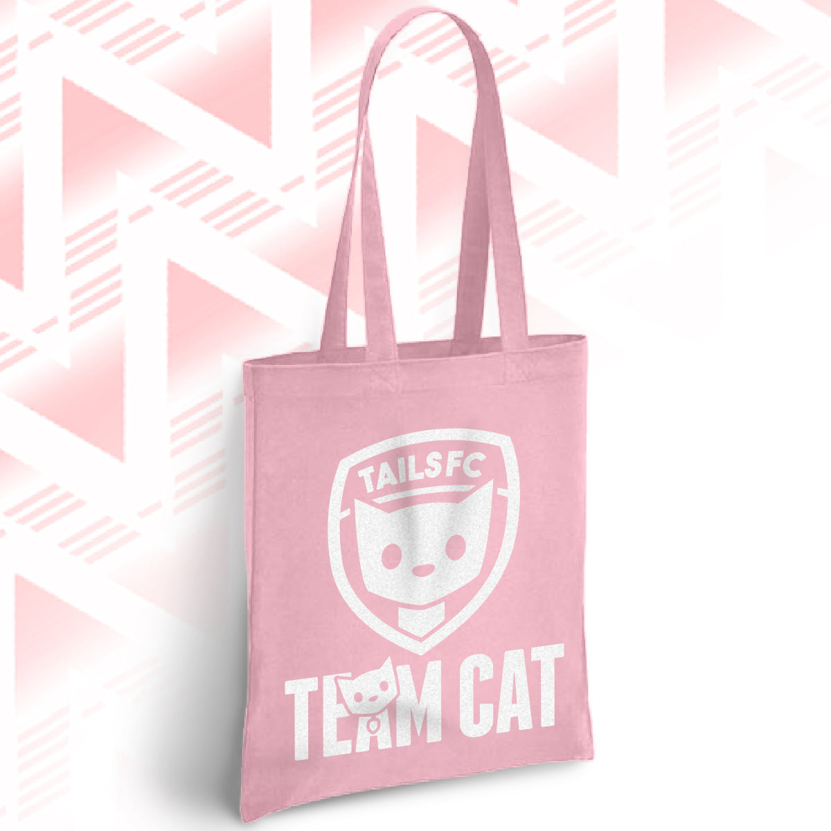 Pink tote bag with 'TAILSFC Team Cat' design on a pink geometric patterned background
