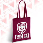 Maroon tote bag with 'TAILSFC Team Cat' design on a geometric patterned background
