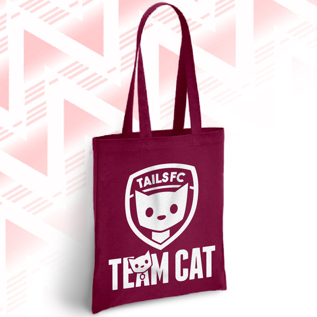 Maroon tote bag with 'TAILSFC Team Cat' design on a geometric patterned background