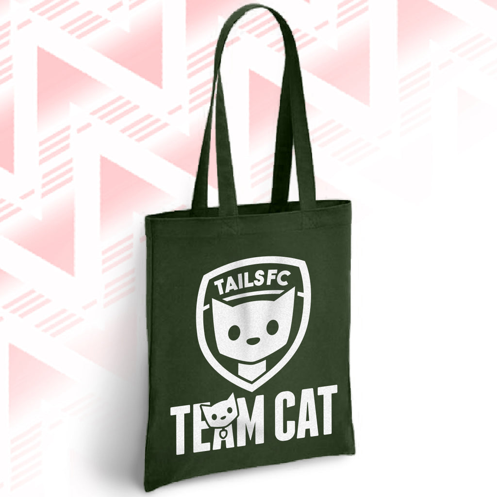 Green tote bag with 'TAILSFC Team Cat' design on a pink and white geometric patterned background