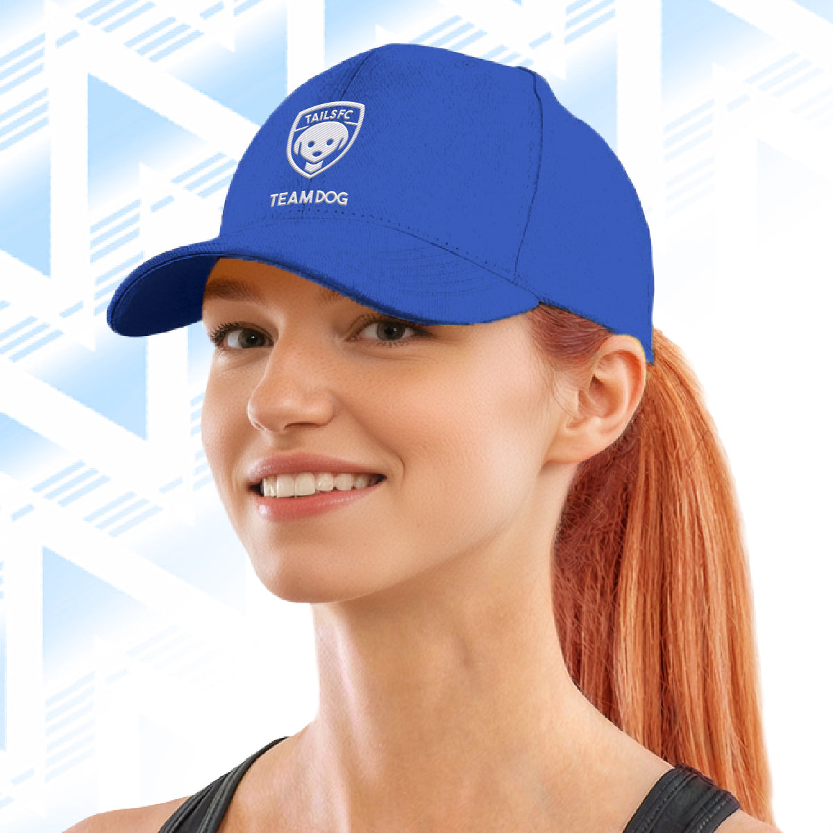 Woman wearing a blue cap with Tails FC  logo and text on a light blue geometric patterned background