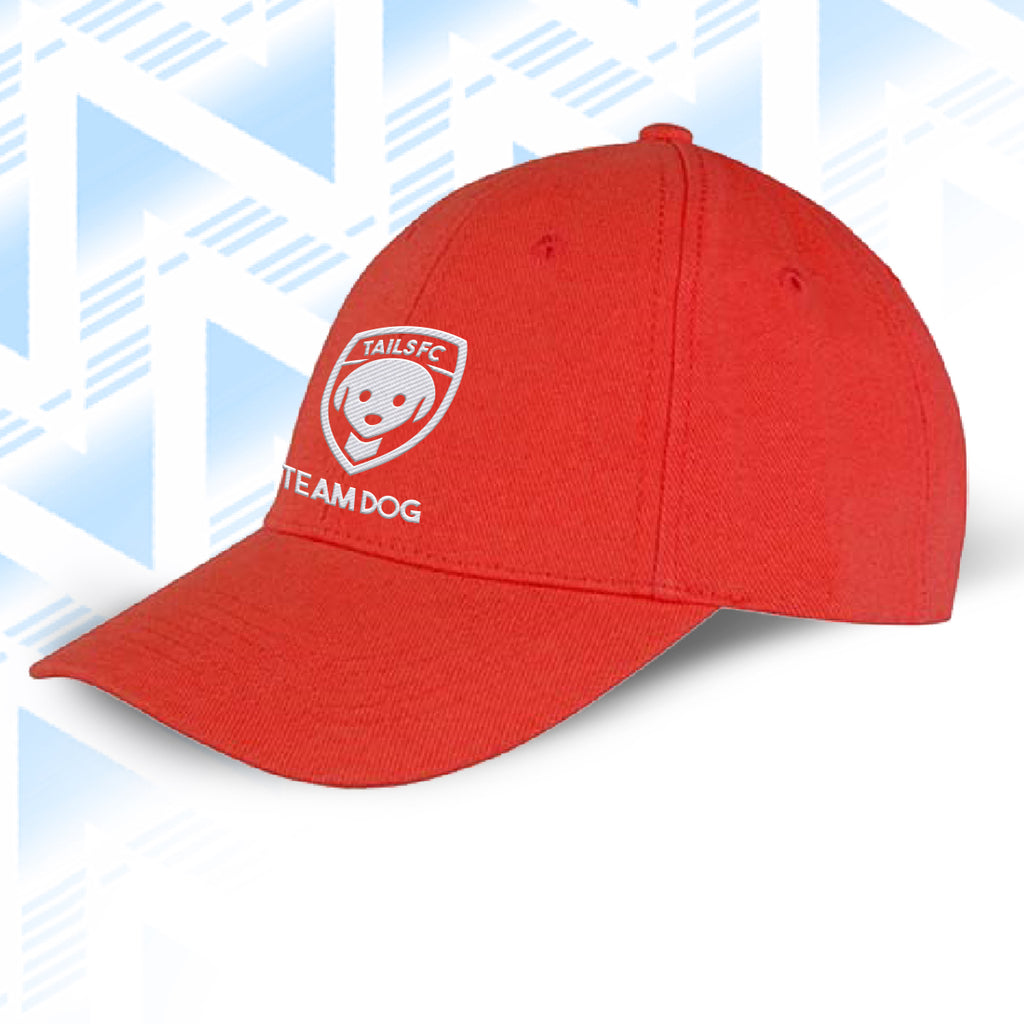 Team Dog Red cap with 'TAILS FC' logo on a light blue geometric patterned background