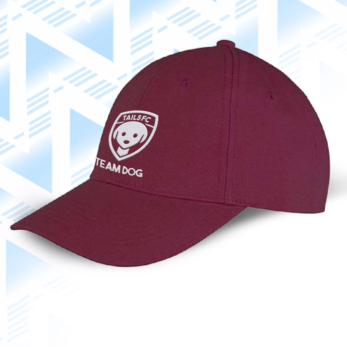 Tails FC Maroon cap with 'Team Dog' logo on a light blue geometric patterned background