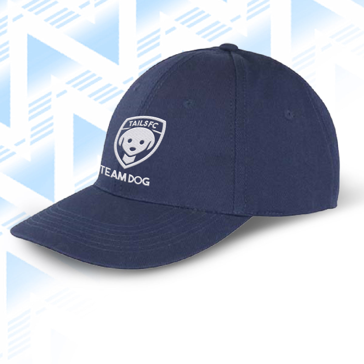 Navy blue cap with 'TAILS FC Team Dog' logo on a light blue geometric patterned background