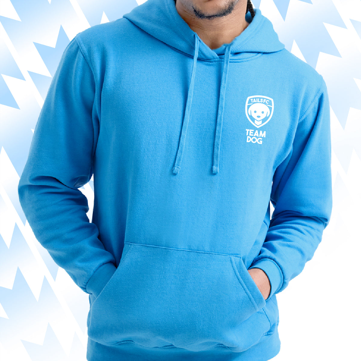 Man wearing a blue Tails FC hoodie with Team Dog logo on a light blue background