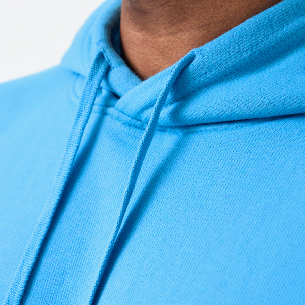 Close-up of a blue Tails FC hoodie with a blurred background