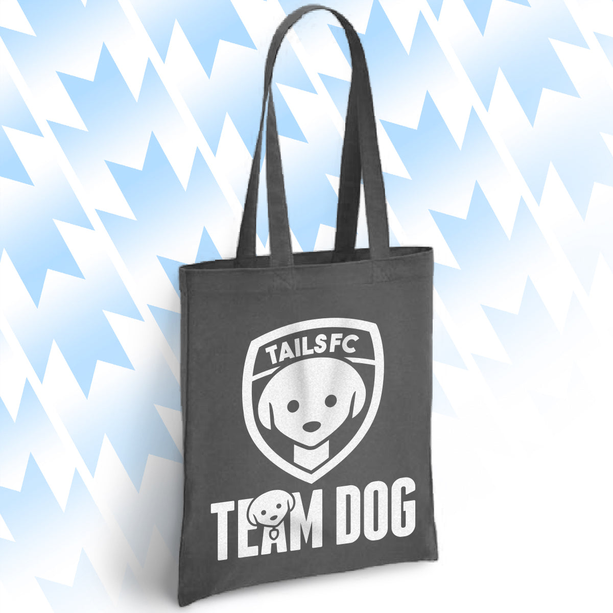 Charcoal tote bag with 'TAILSFC Team Dog' logo on a light blue background