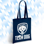 Navy blue tote bag with 'TAILSFC Team Dog' logo on a light blue abstract background