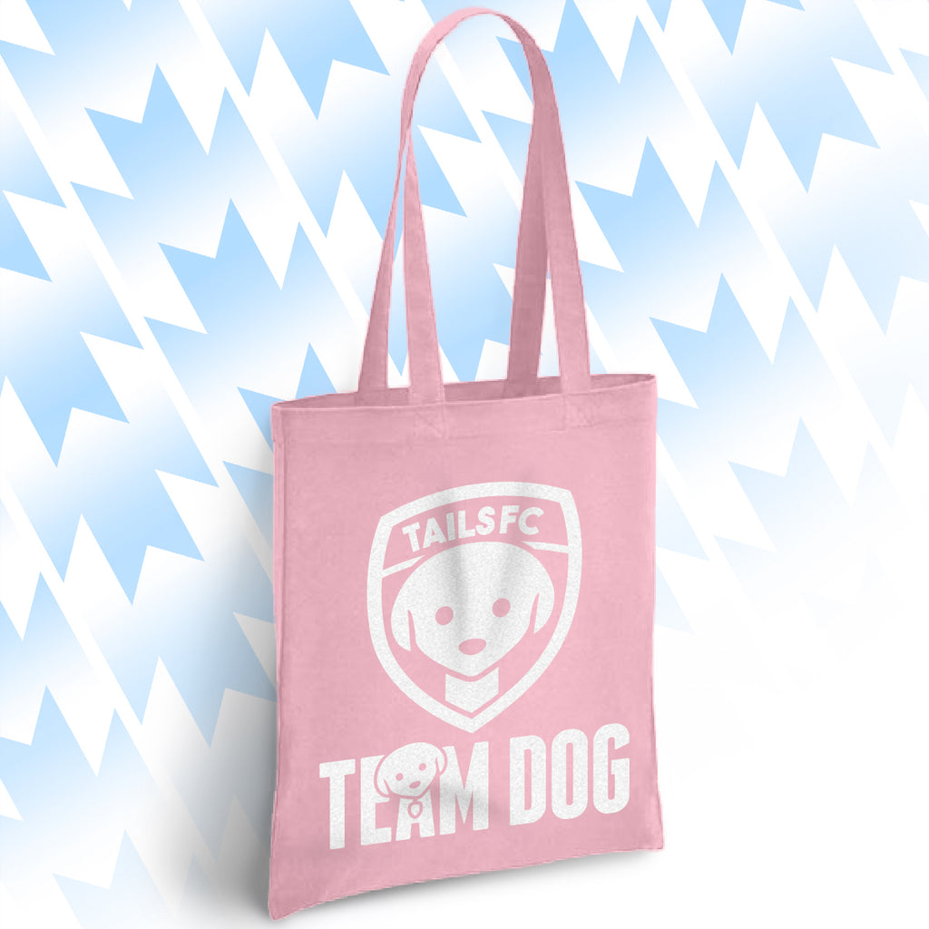 Pink tote bag with 'TAILSFC Team Dog' design on a light blue background