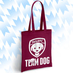 Maroon tote bag with 'TAILSFC Team Dog' logo on a light blue background