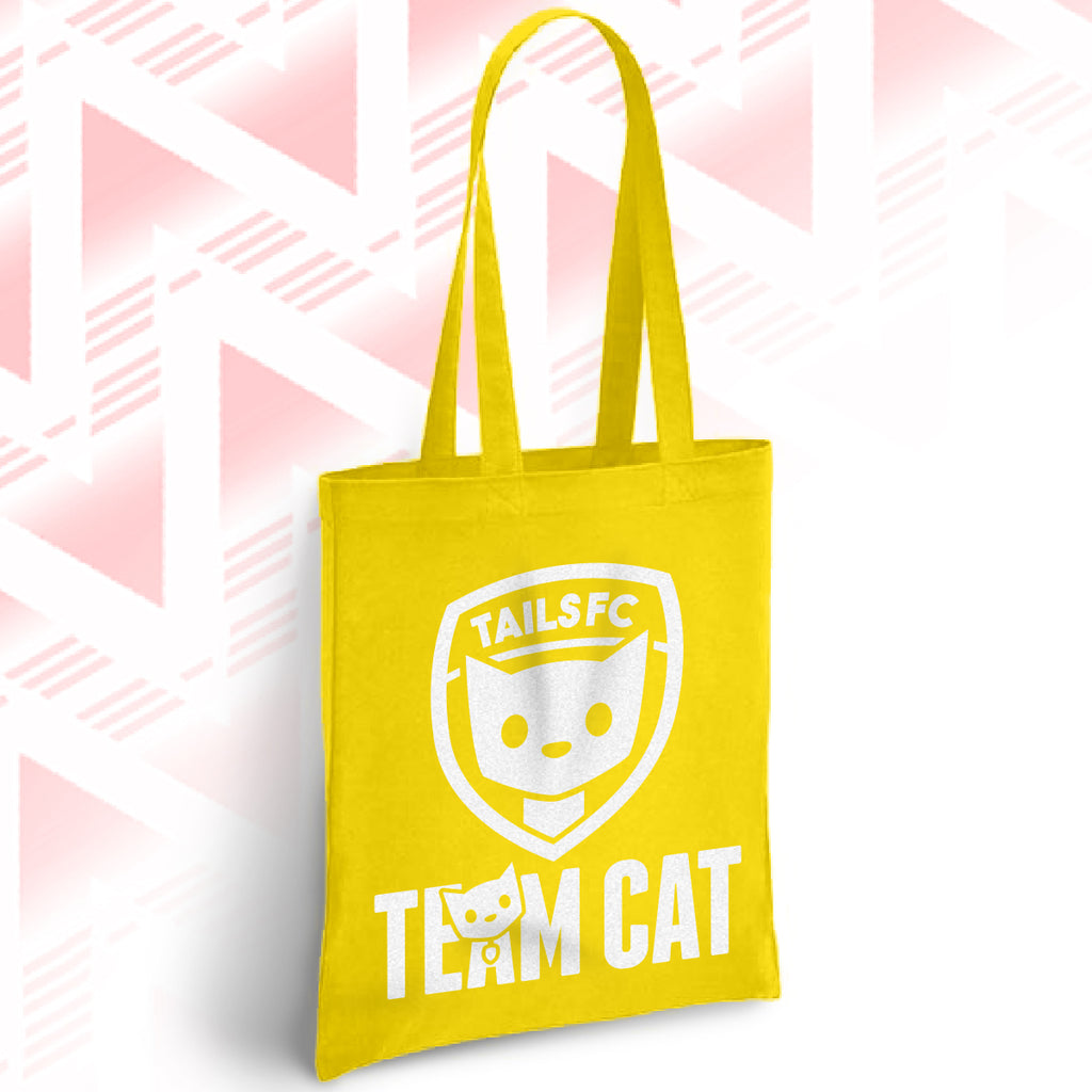 Yellow tote bag with 'TAILSFC Team Cat' design on a geometric patterned background