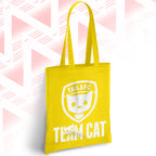 Yellow tote bag with 'TAILSFC Team Cat' design on a geometric patterned background