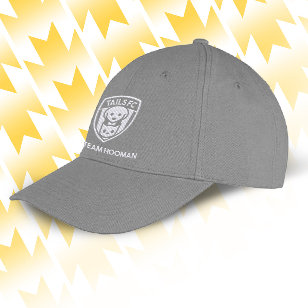 Tails FC Gray cap with logo and text on a yellow and white abstract background