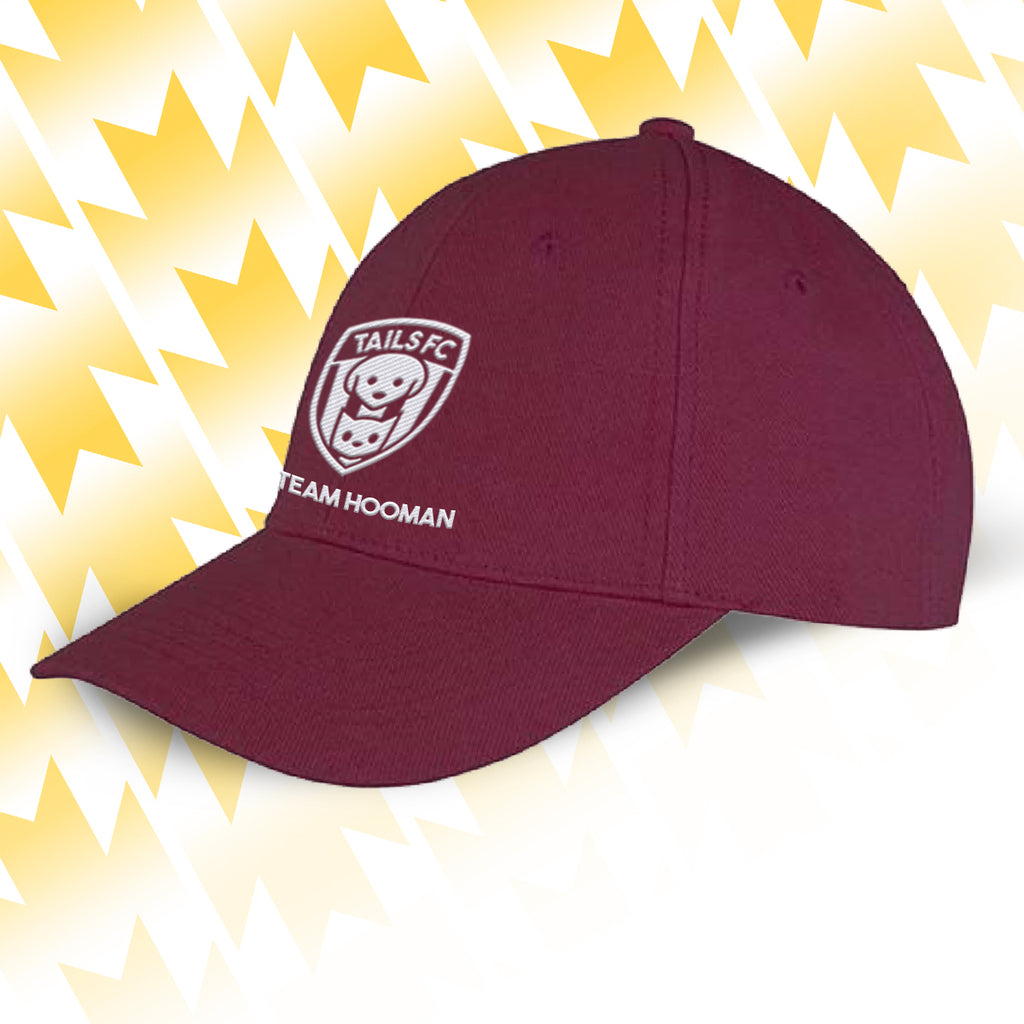 Tails FC Maroon cap with Team Hooman logo and text on a yellow and white abstract background