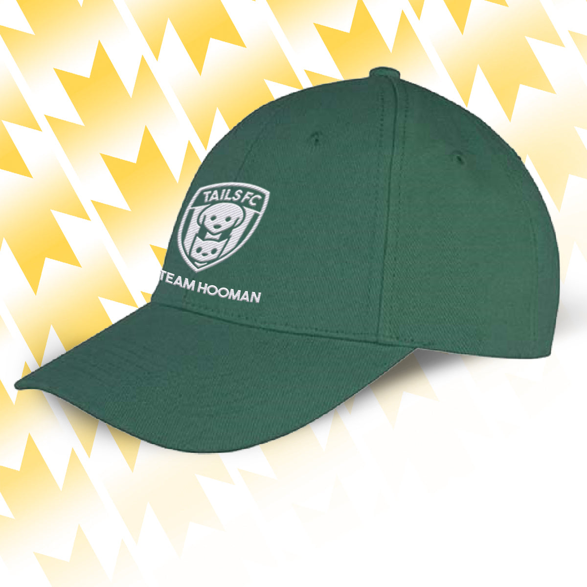 Tails FC Green cap with a Team Hooman logo and text on a yellow and white abstract background