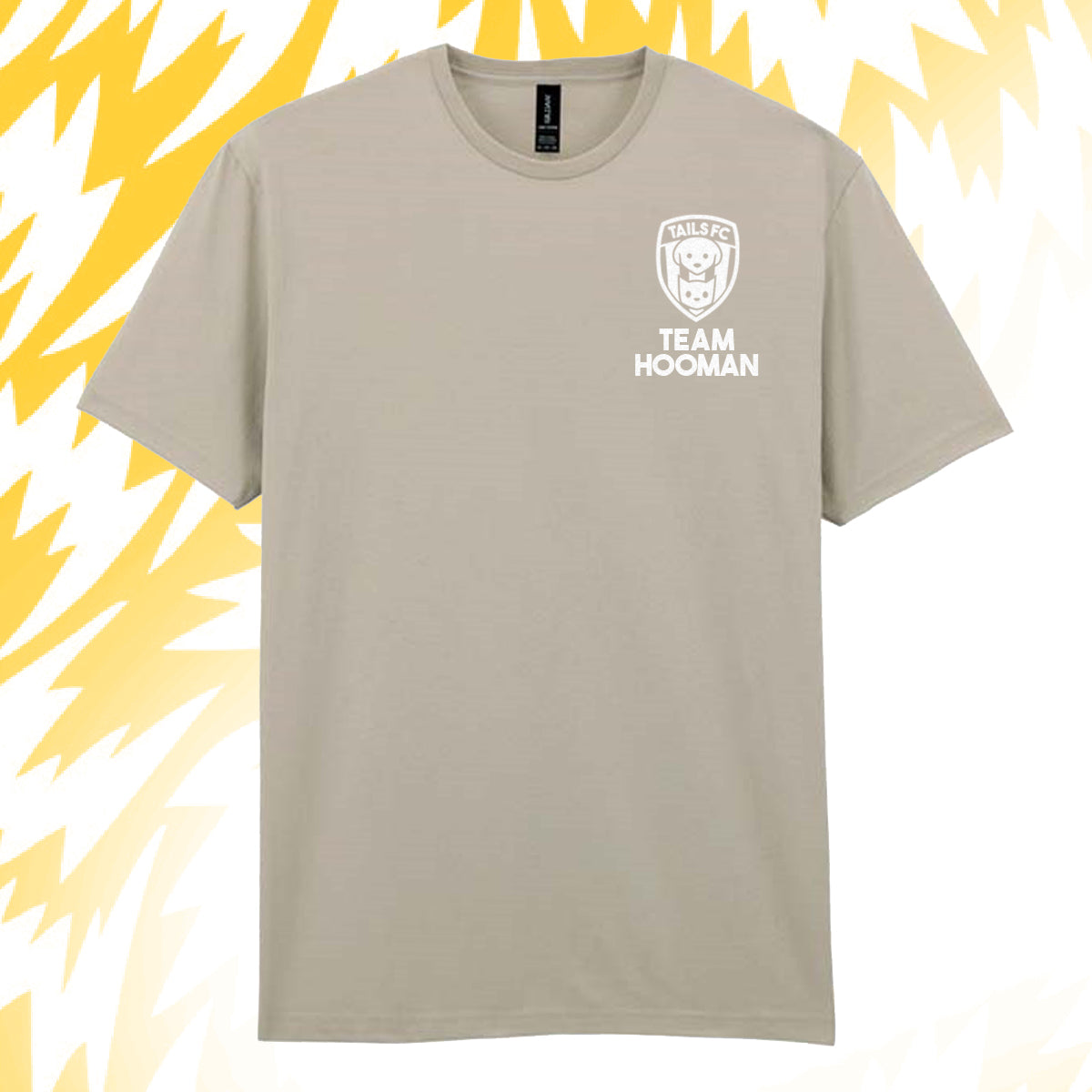 Tails FC Beige t-shirt with 'Team Hooman' logo on a yellow and white abstract background