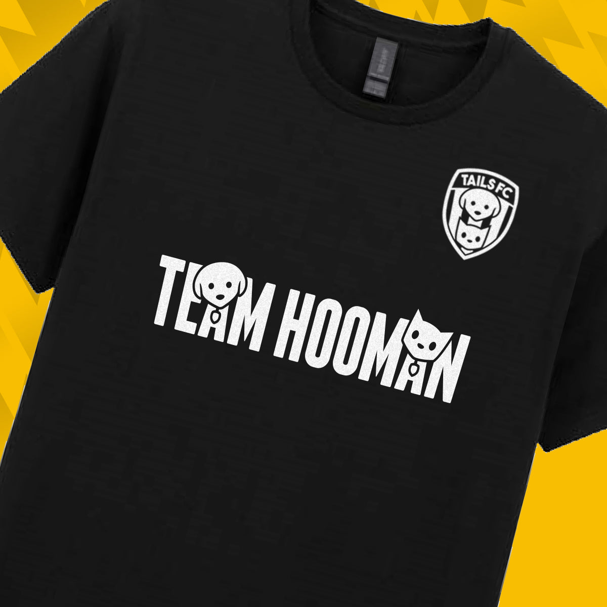 Tails FC Black t-shirt with 'Team Hooman' text and logo on a yellow background