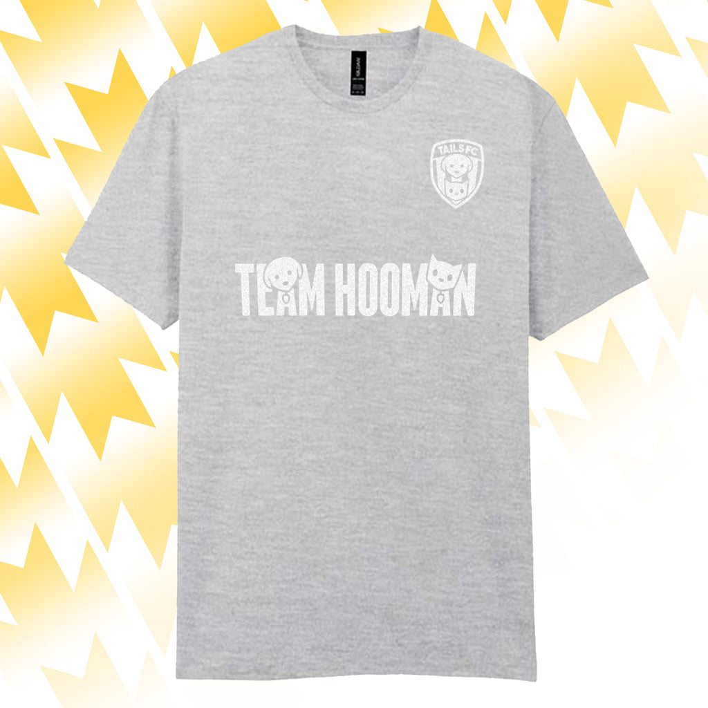 Tails FC Gray t-shirt with 'Team Hooman' text and logo on a yellow and white abstract background