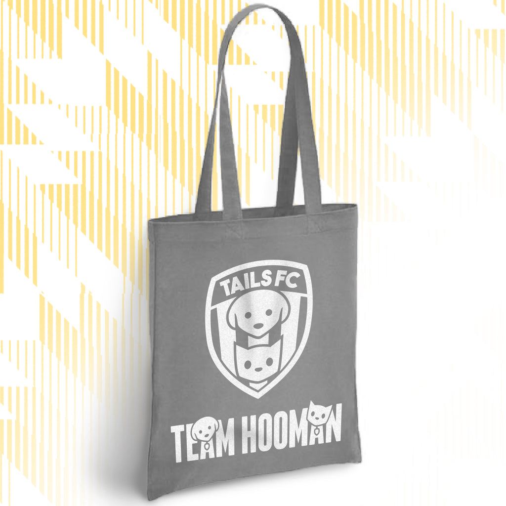 Gray tote bag with 'TAILS FC' and 'Team Hooman' design on a white background