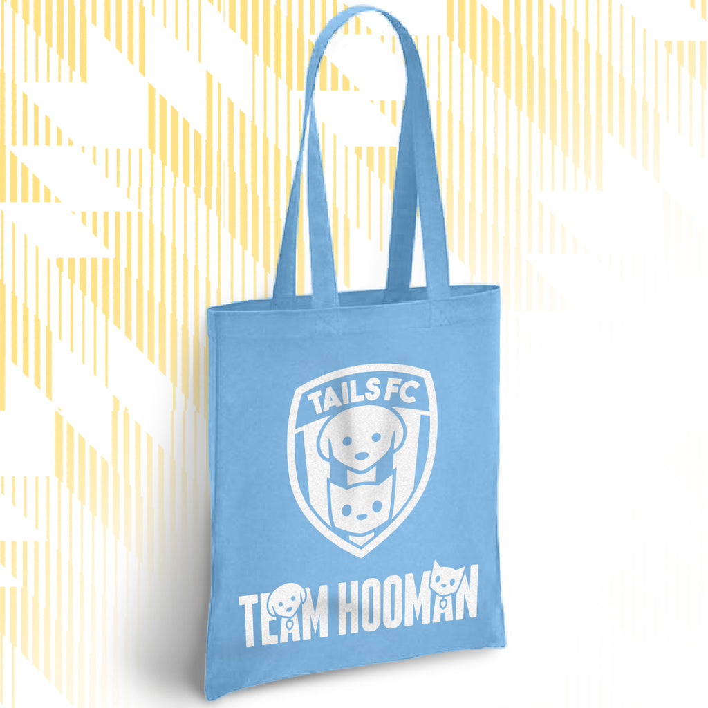 Blue tote bag with 'TAILS FC' and 'Team Hooman' design on a white background