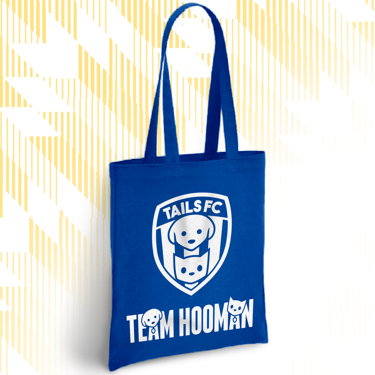 Blue tote bag with 'TAILS FC' and 'Team Hooman' design on a white background