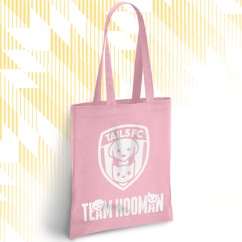 Pink tote bag with 'TAILSFC' and 'TEAM HOOMAN' text on a white background