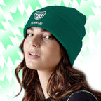 Person wearing a green beanie with Tails FC 'Team Cat' logo and text against a light green and white geometric patterned background