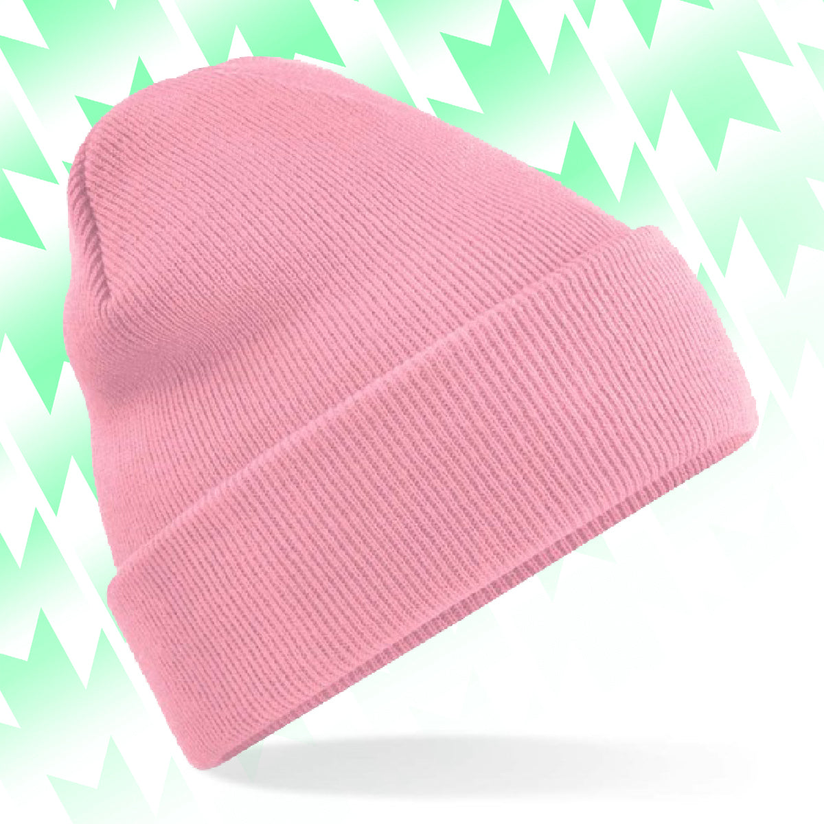 Tails FC Pink beanie on a light green and white patterned background