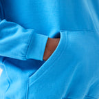 Close-up of a blue Tails FC hoodie with a pocket