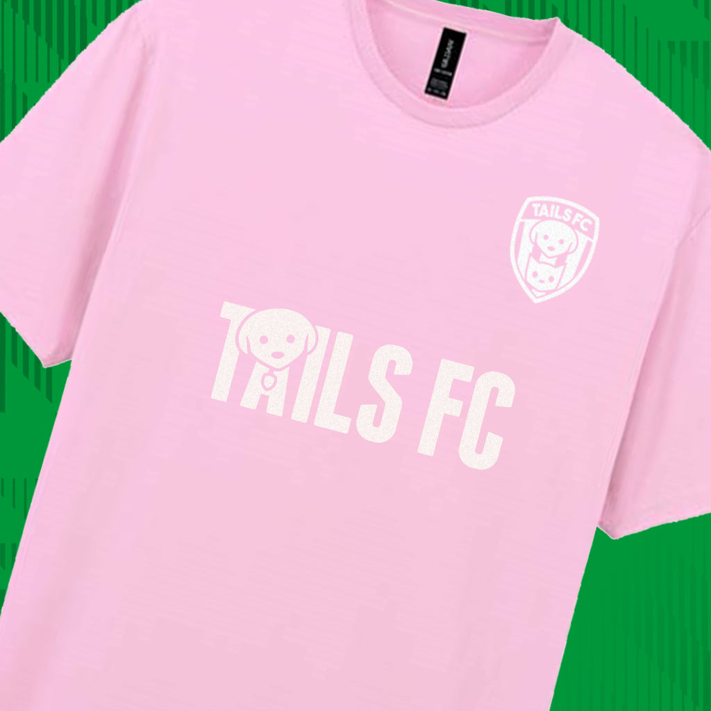 Pink t-shirt with 'TAILS FC' text and logo on a green background