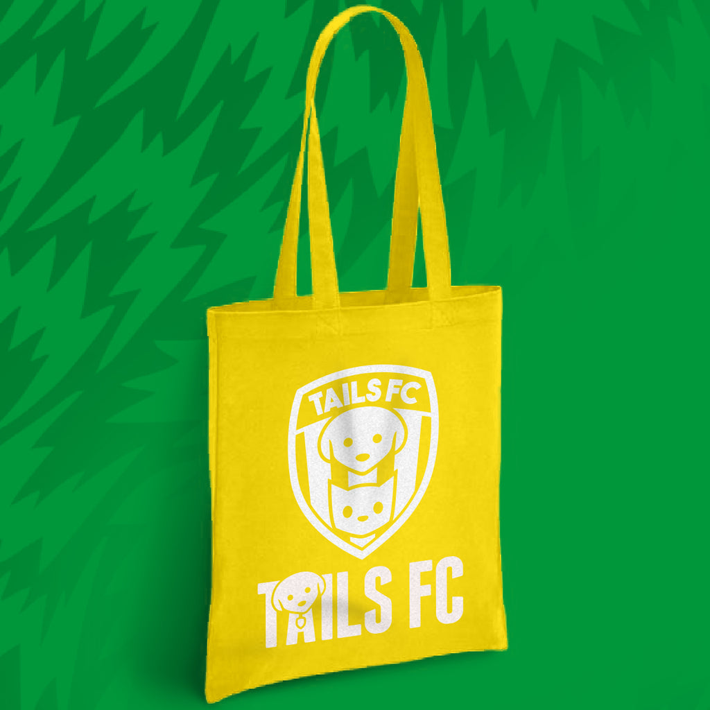 Yellow tote bag with 'TAILS FC' logo on a green background