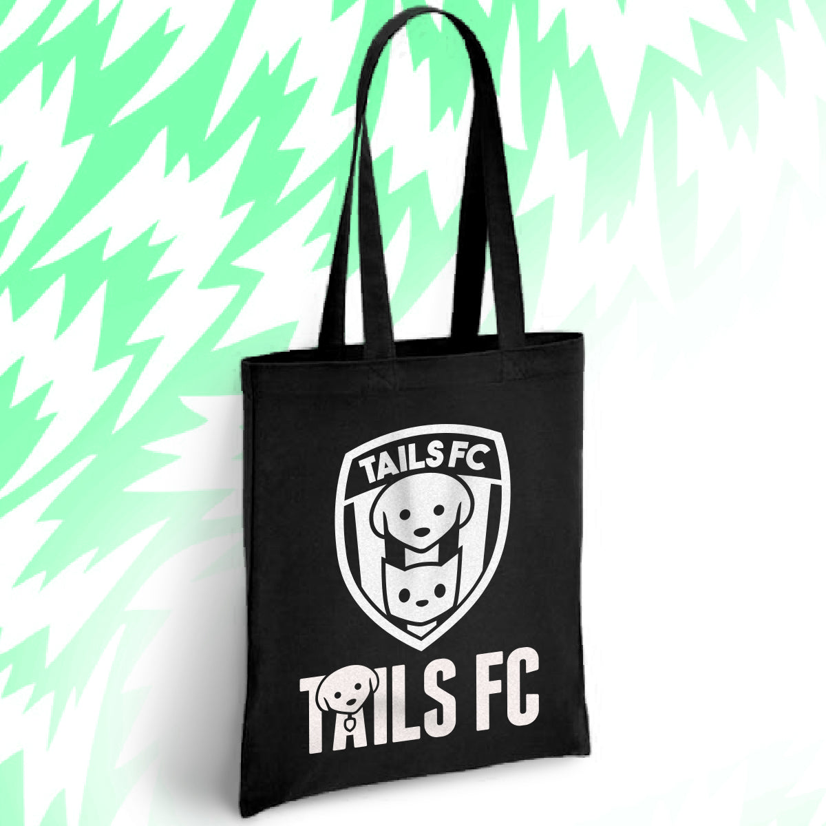 Black tote bag with 'TAILS FC' logo on a light green background