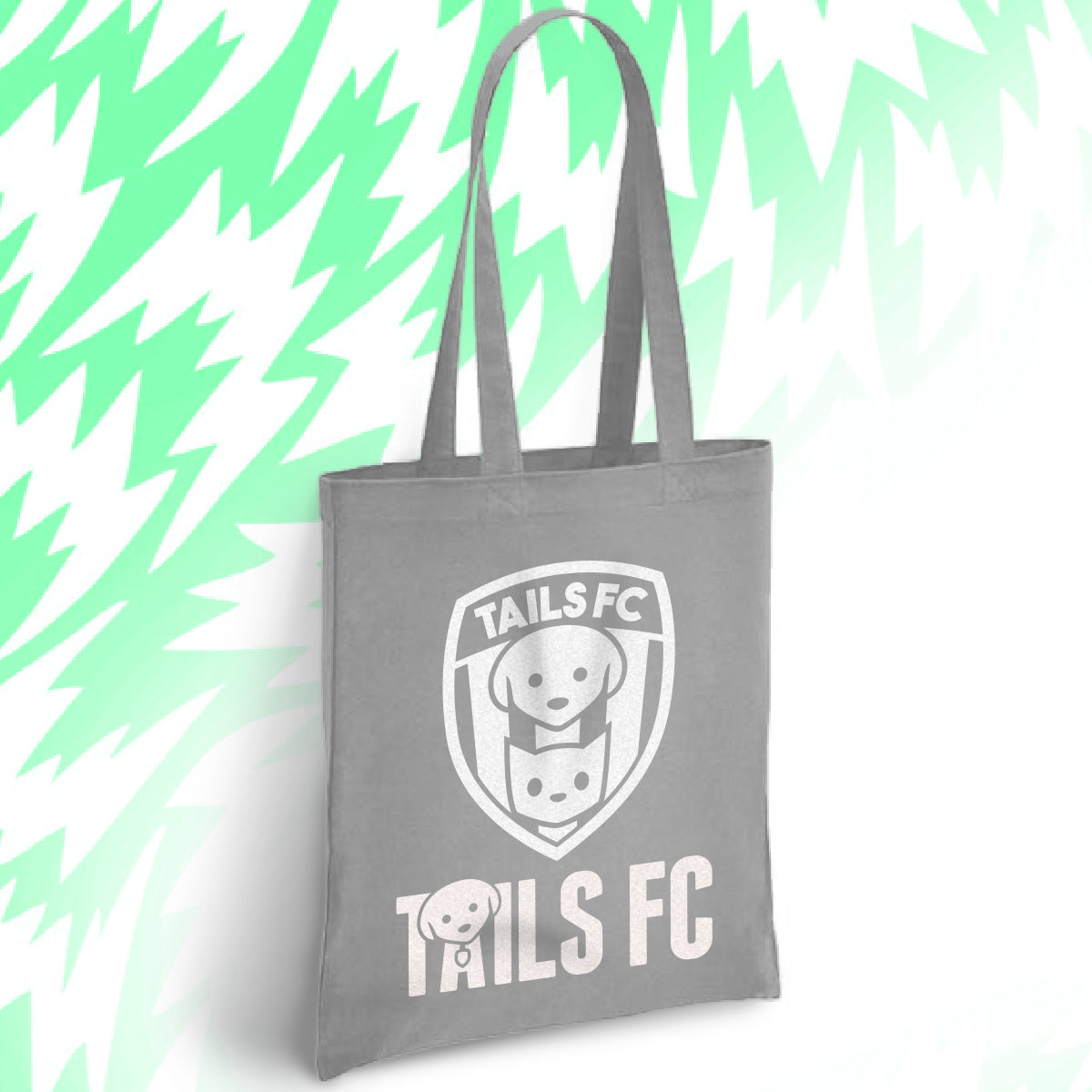 Gray tote bag with 'TAILS FC' logo on a light green abstract background